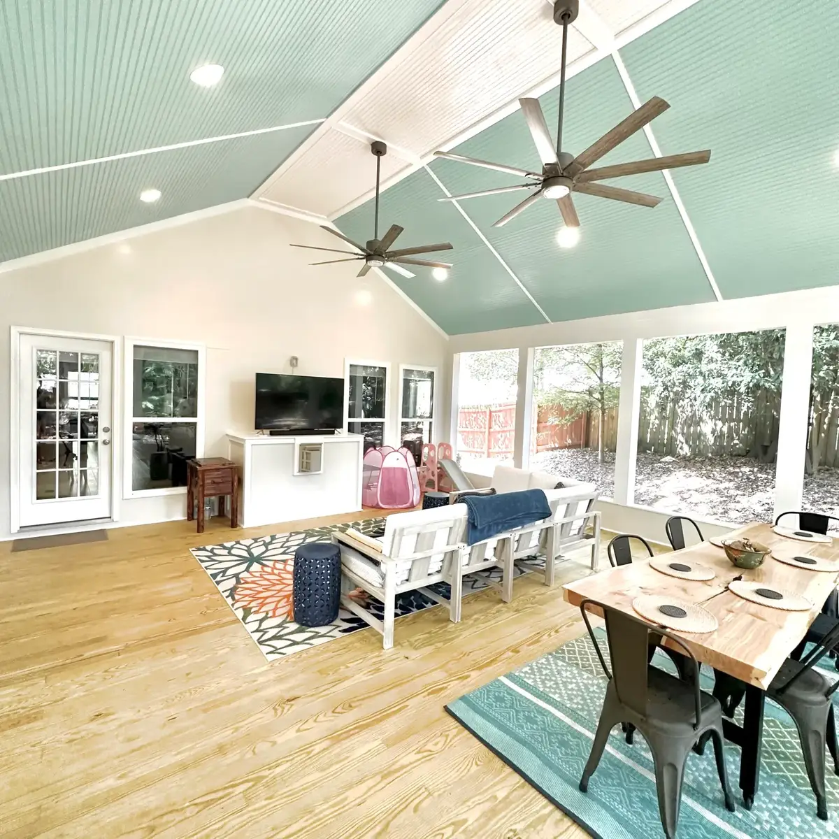 Interior of the Atlanta screen room with painted bead-board ceiling, fans and pine flooring