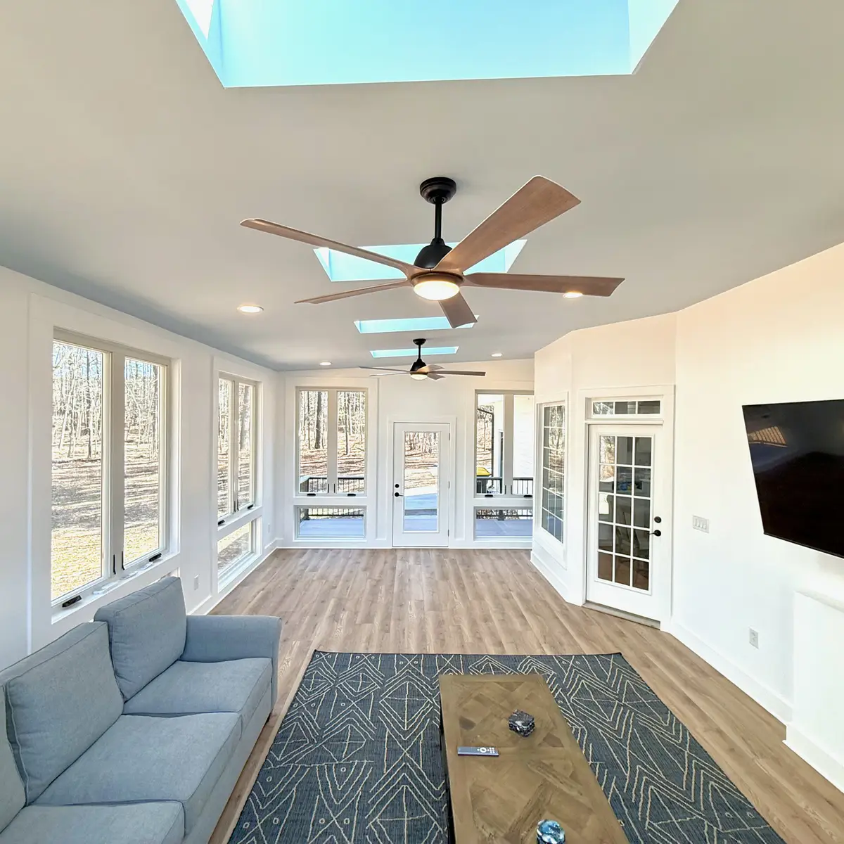 sunroom with skylights, windows and LVP flooring