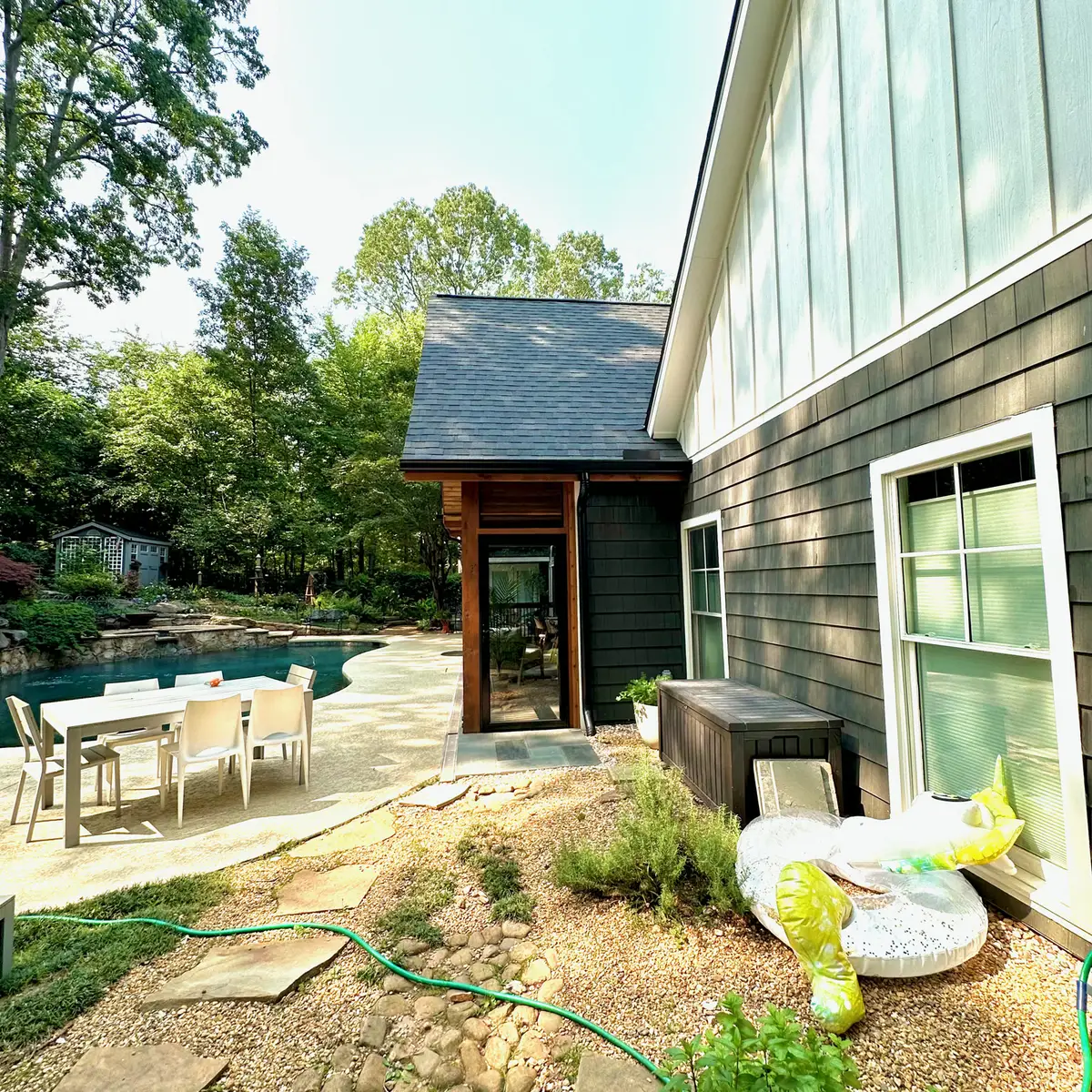 Screened porch addition exterior next to a pool deck