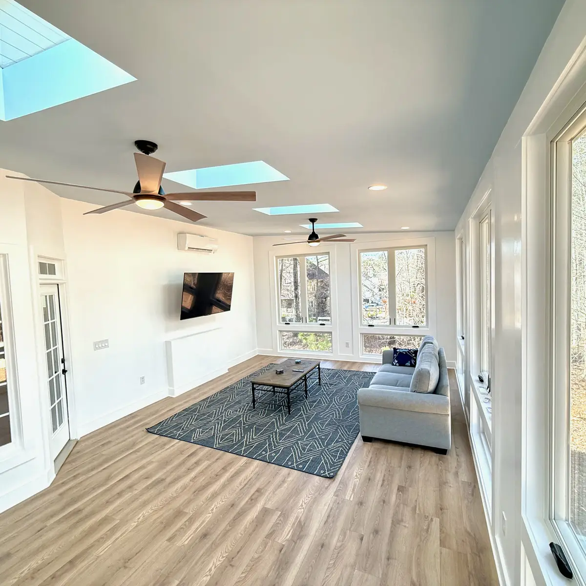 Sunroom addition with skylights, ceiling fans and LVP flooring