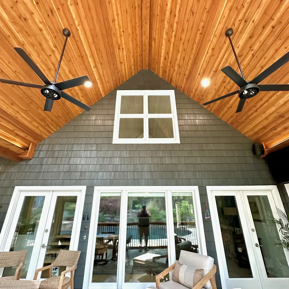 Vaulted cedar ceiling with fans in a screened porch