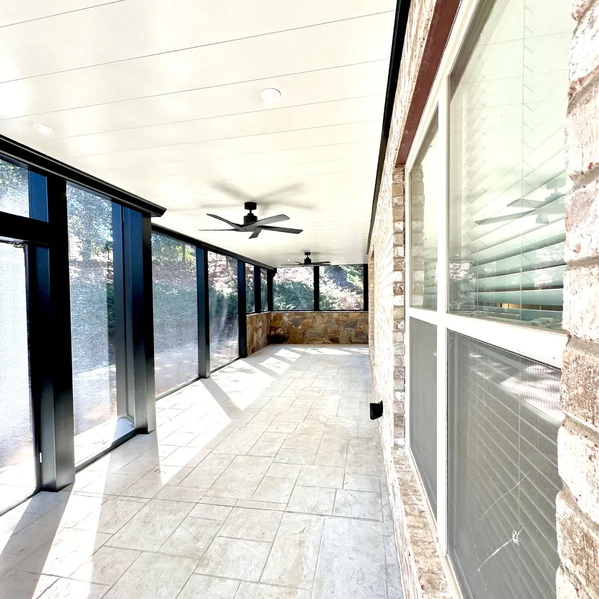 Long screened patio with black frames