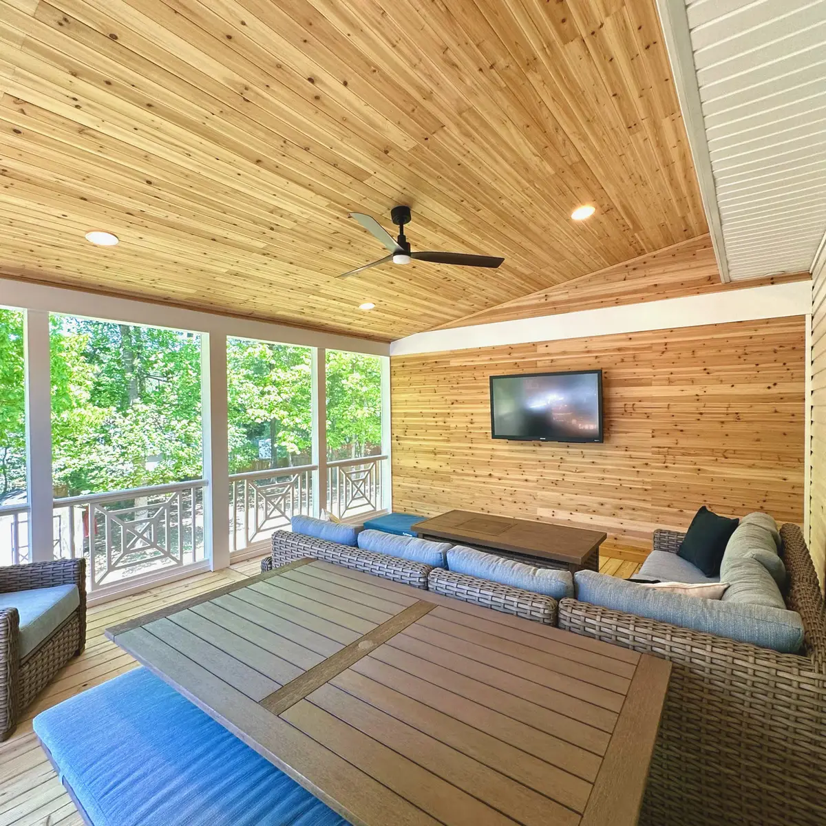 Screened porch with tongue-and-groove pine ceiling, cedar wall and TV