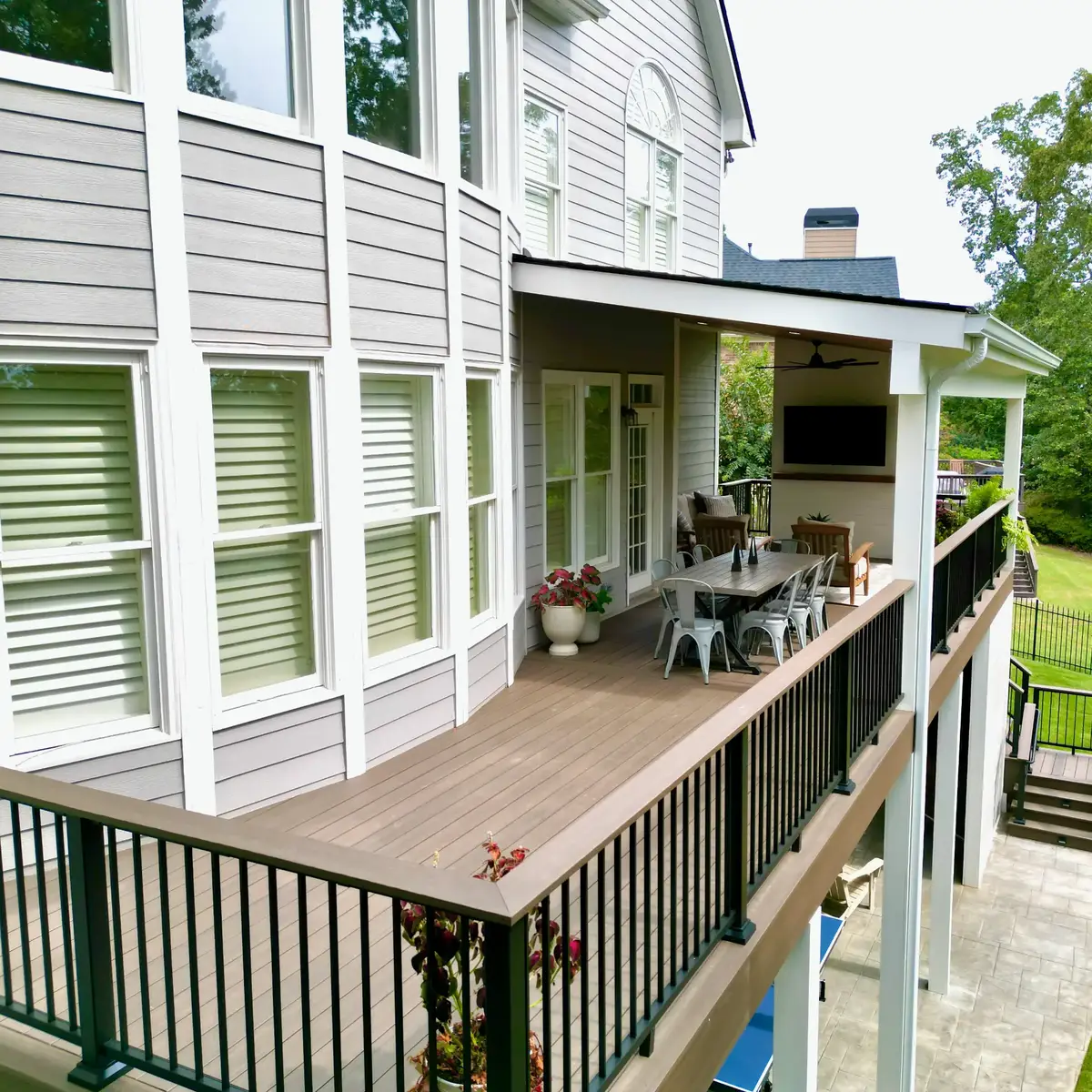Side view along the Smyrna PVC deck toward the covered dining area and television