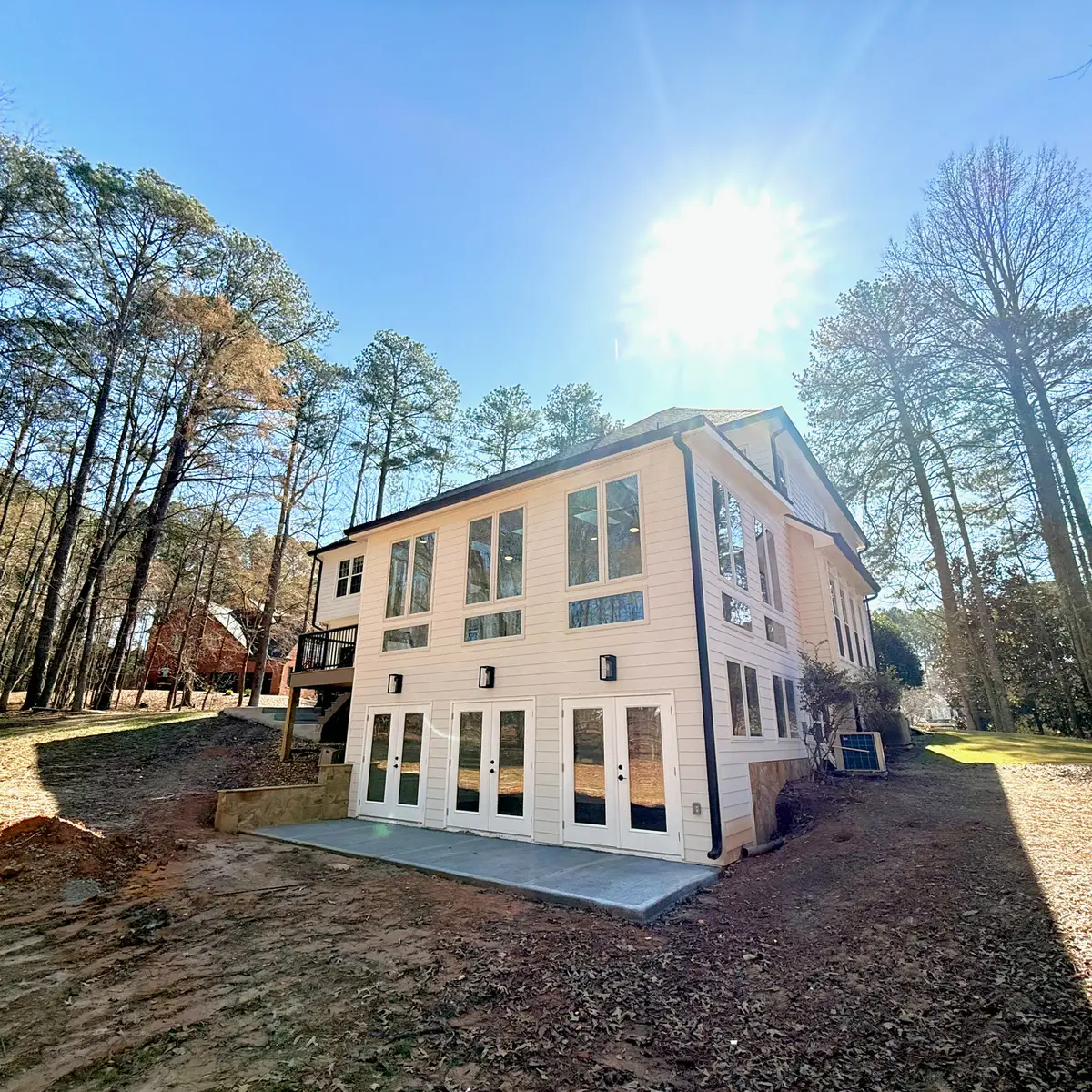 Exterior of a two-story home addition with many windows