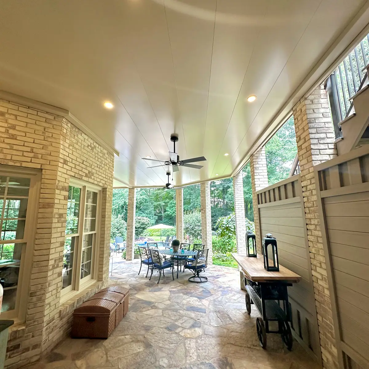Covered flagstone patio beneath a deck