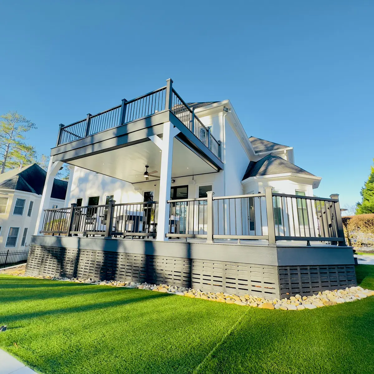 Two-story deck with upper balcony and lower covered area