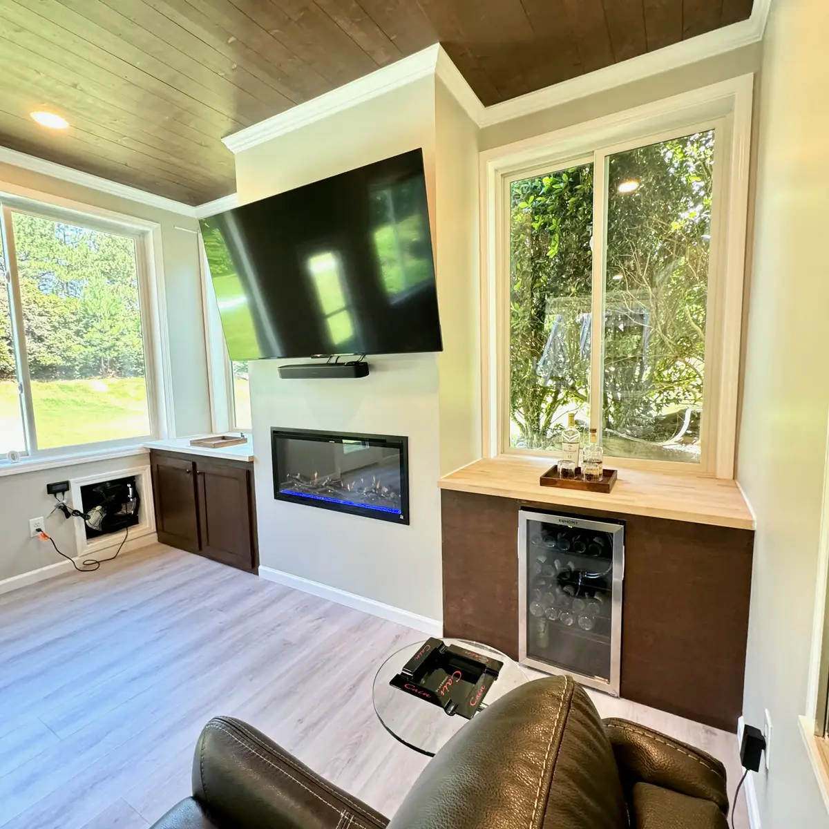 Sunroom with built-in cabinets, TV and electric fireplace