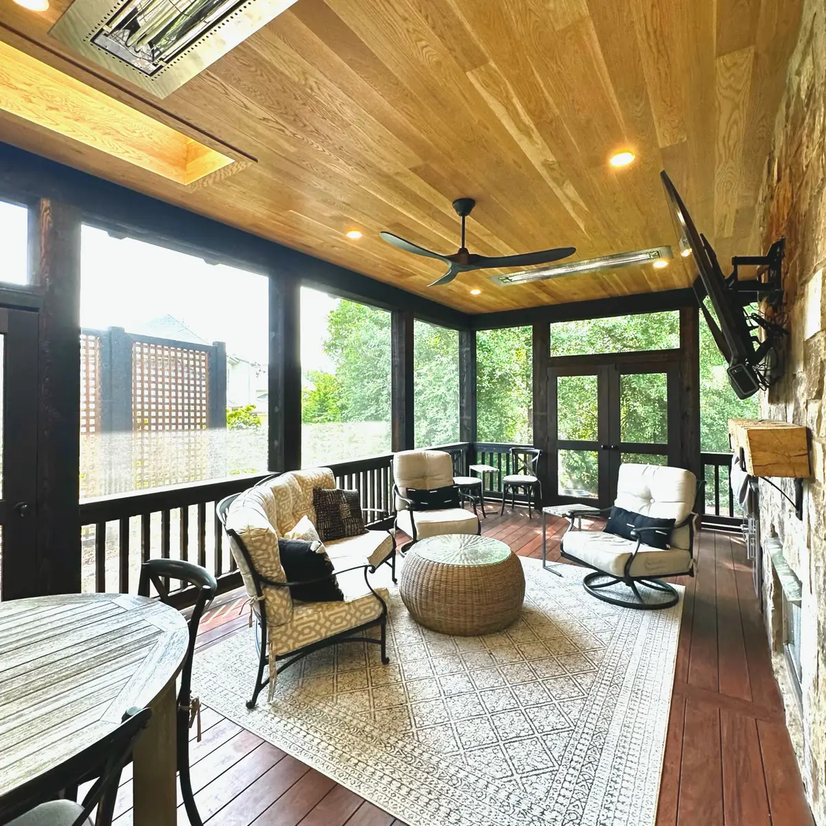 Screened porch with cedar ceiling, ceiling fan and outdoor seating