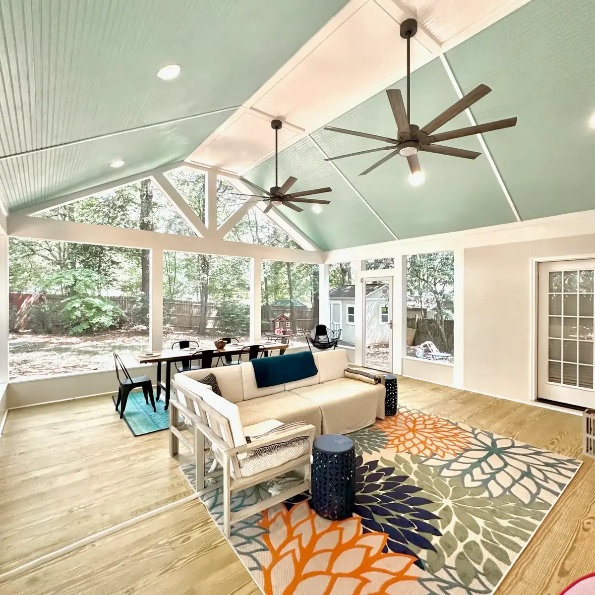 Gable end of the Atlanta screen room with exposed trusses and mint bead-board ceiling