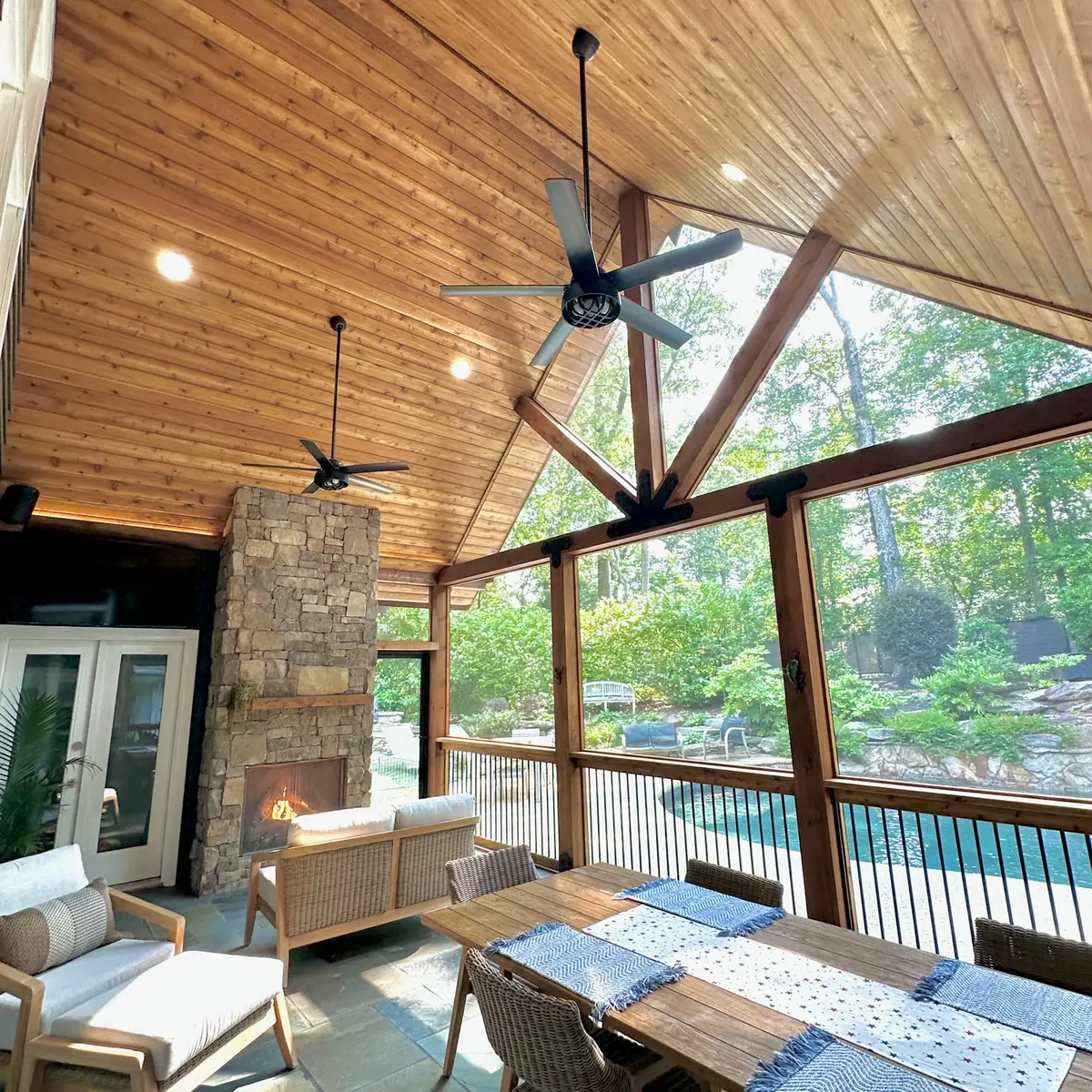 Screened porch with cedar ceiling and pool view