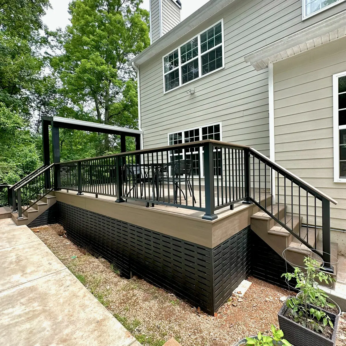 Composite deck with black lattice skirting and stairs to the pool